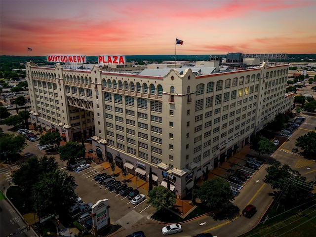 view of outdoor building at dusk