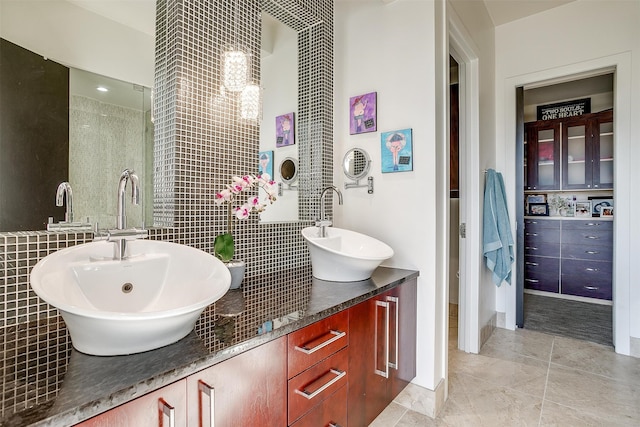 bathroom with vanity, plus walk in shower, tile walls, and tile patterned floors