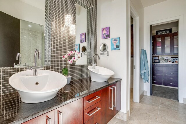 2600 W 7th St Unit 2746, Fort Worth, TX 76107 - bathroom featuring double vanity, tile patterned floors, and tile walls