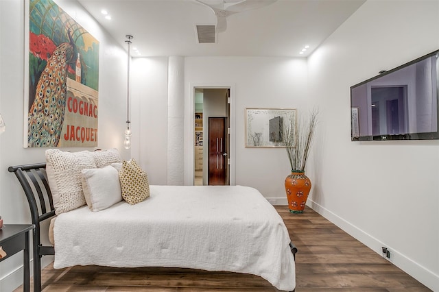 bedroom featuring ceiling fan and dark hardwood / wood-style flooring