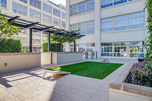 exterior space with a pergola and a patio area