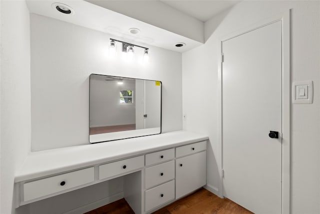 bathroom featuring hardwood / wood-style flooring and vanity