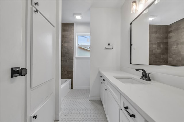 full bath with shower / bathtub combination, tile patterned flooring, vanity, and baseboards