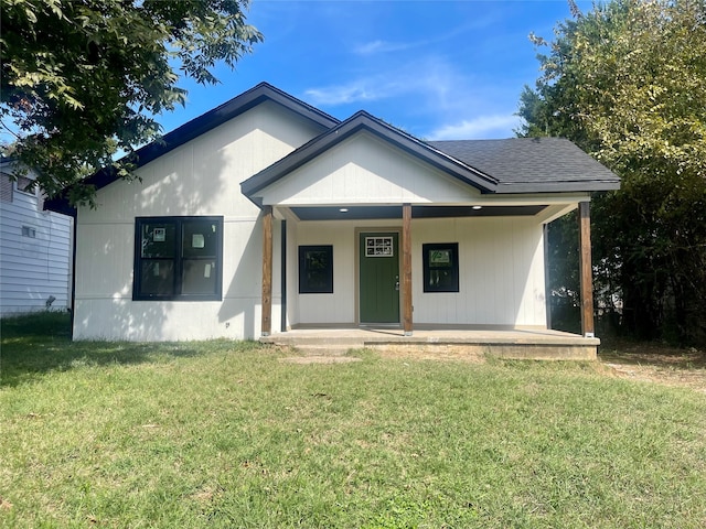 bungalow-style home featuring a front yard and a porch