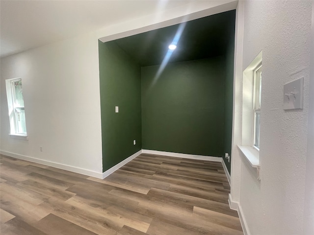 unfurnished room featuring hardwood / wood-style floors