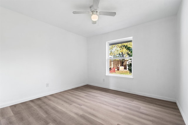 empty room featuring ceiling fan and light hardwood / wood-style floors