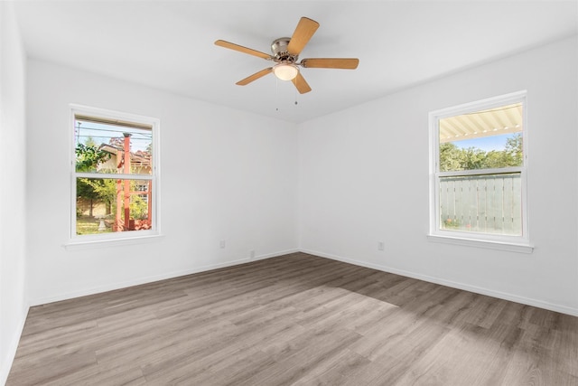 unfurnished room featuring light hardwood / wood-style floors and ceiling fan