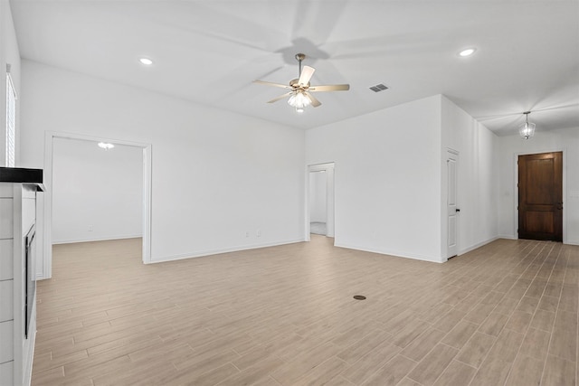 unfurnished living room featuring light wood-type flooring and ceiling fan