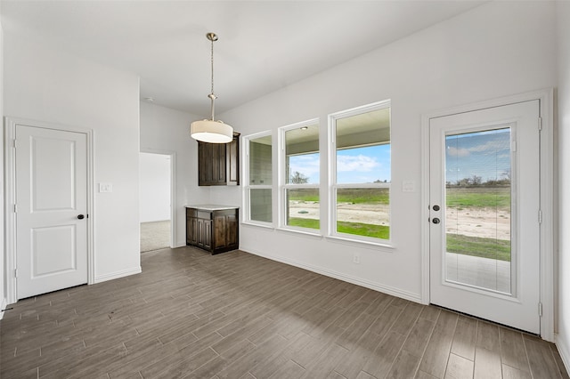 unfurnished living room with wood-type flooring