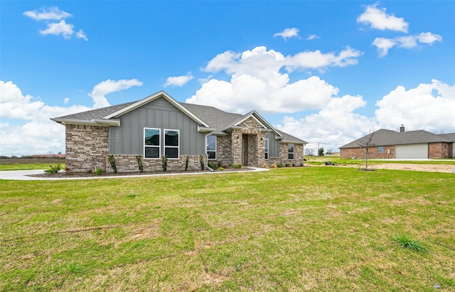 view of front of property with a front yard and a garage