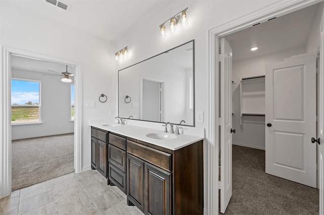 bathroom featuring vanity and ceiling fan