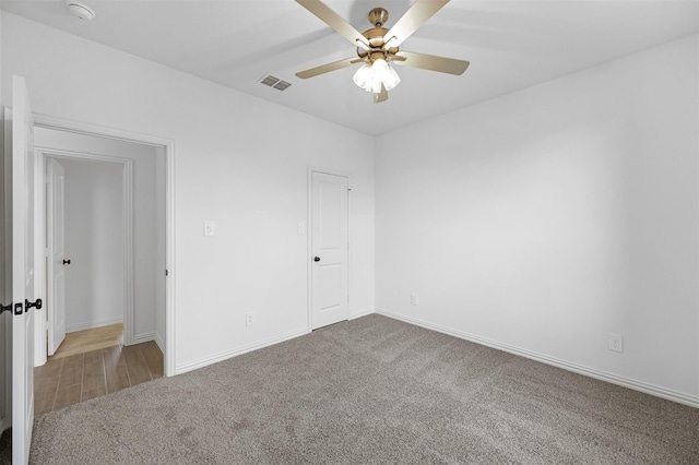 unfurnished room featuring carpet floors and ceiling fan