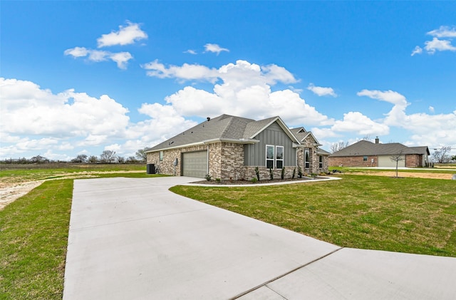 view of front of property featuring a front yard and a garage