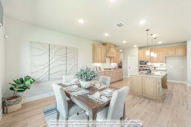 dining area with light hardwood / wood-style flooring