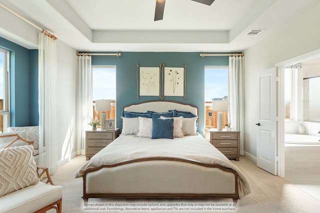 bedroom with ceiling fan, light carpet, and multiple windows