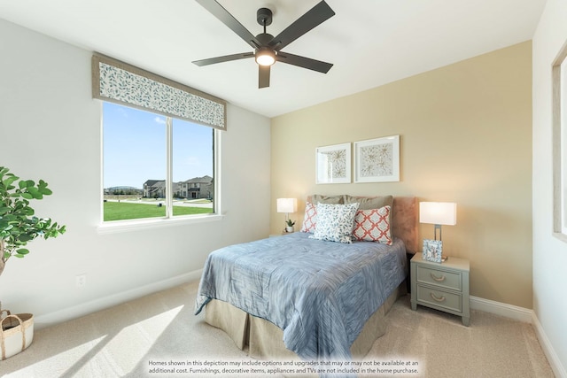 bedroom with light carpet and ceiling fan