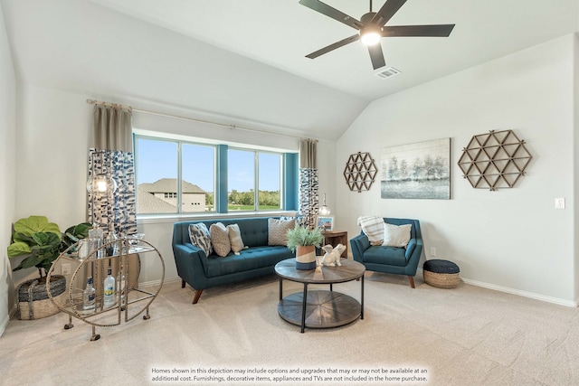 carpeted living room with ceiling fan and lofted ceiling