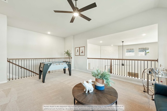 sitting room featuring ceiling fan and light colored carpet