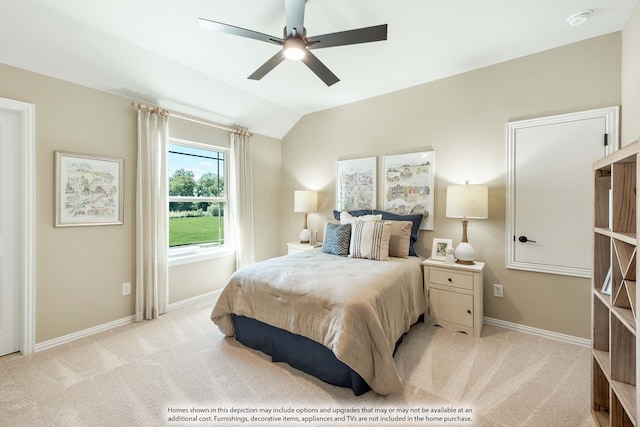 bedroom featuring vaulted ceiling, ceiling fan, and light colored carpet