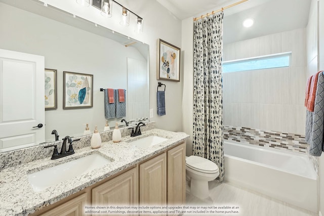 full bathroom with vanity, toilet, tile patterned floors, and shower / bath combination with curtain