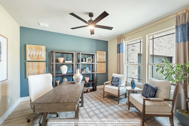 office featuring hardwood / wood-style floors and ceiling fan