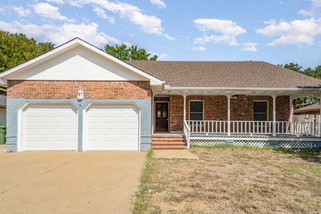 ranch-style home with covered porch and a garage