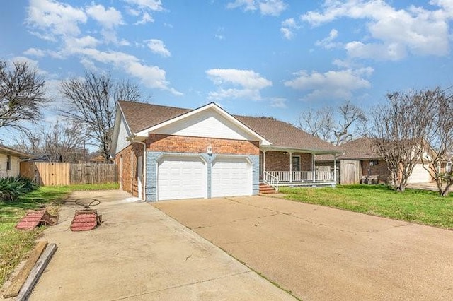 ranch-style home featuring brick siding, fence, a porch, driveway, and an attached garage