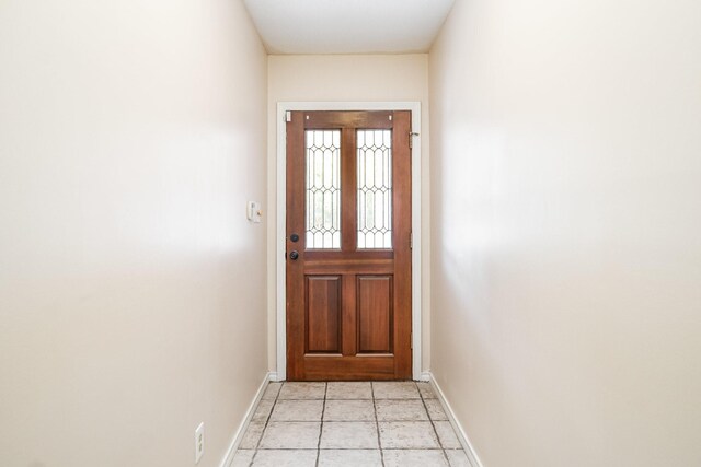 doorway featuring light tile patterned floors