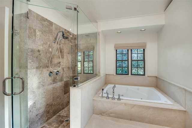 bathroom with separate shower and tub