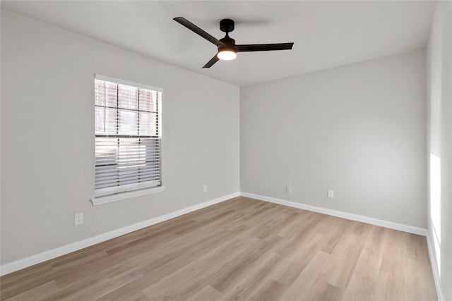 unfurnished room featuring ceiling fan and light wood-type flooring