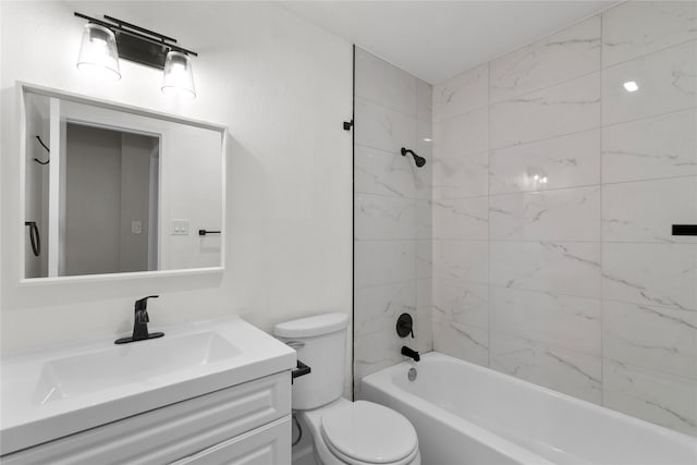 full bathroom featuring vanity, toilet, and tiled shower / bath