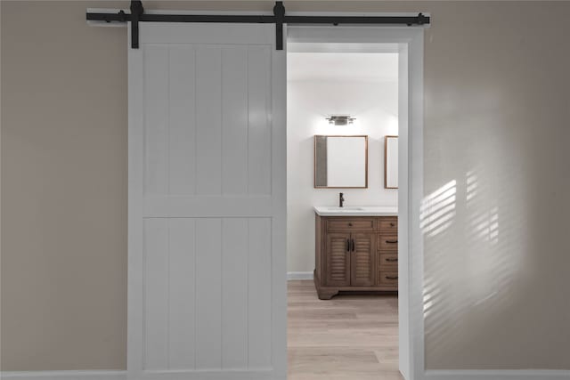 bathroom with vanity and hardwood / wood-style flooring