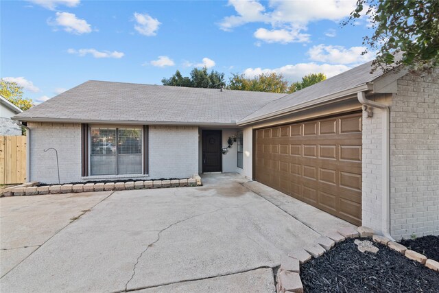 single story home with a garage