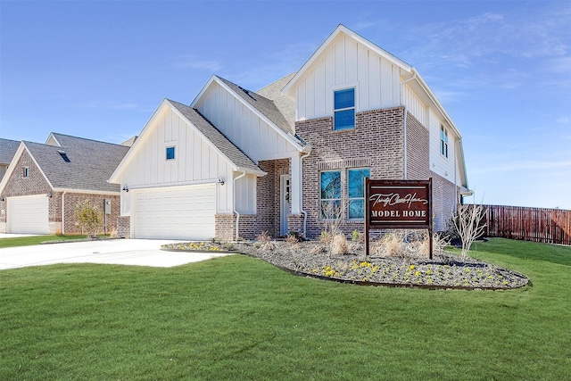 view of front of home with a front yard and a garage