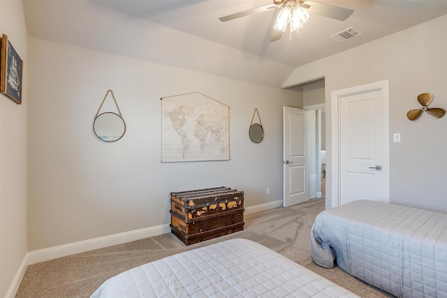 carpeted bedroom featuring vaulted ceiling and ceiling fan