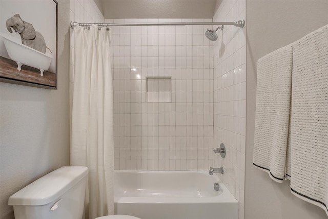 bathroom with shower / tub combo and toilet