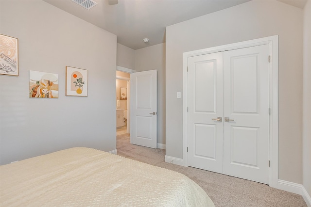 carpeted bedroom featuring a closet