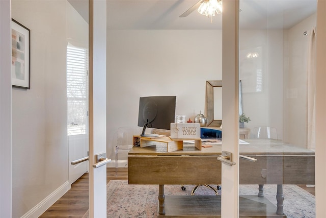 office space featuring hardwood / wood-style floors, ceiling fan, french doors, and a wealth of natural light