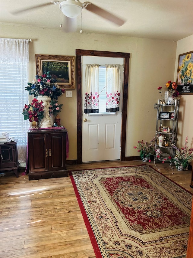 entrance foyer with light wood-type flooring and ceiling fan