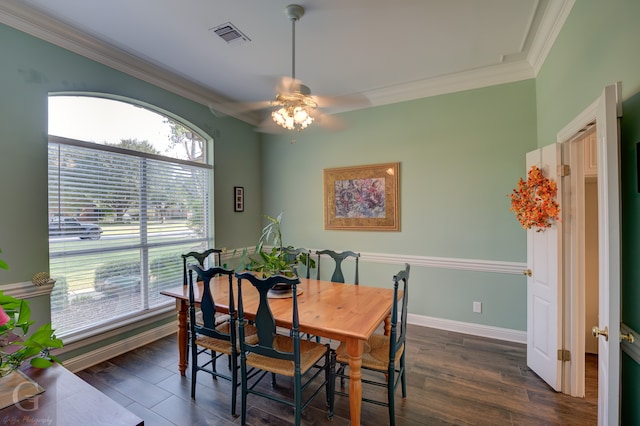 dining space with crown molding, dark hardwood / wood-style floors, and ceiling fan