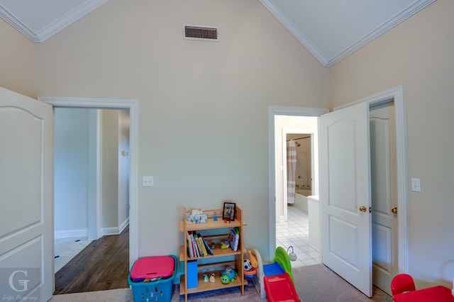 playroom with high vaulted ceiling, dark wood-type flooring, and crown molding