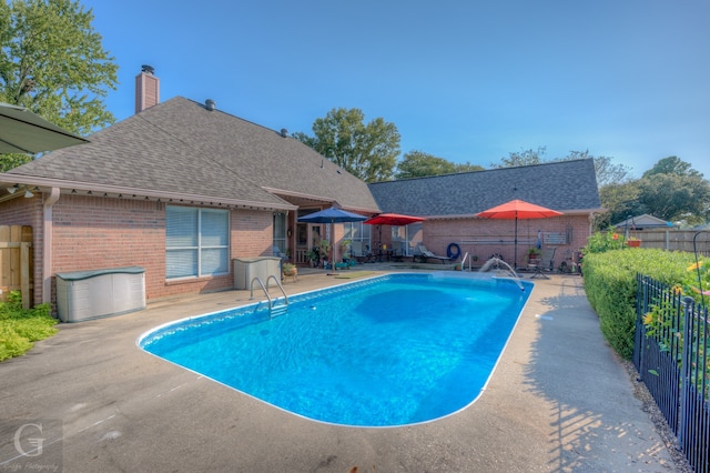 view of swimming pool featuring a patio area