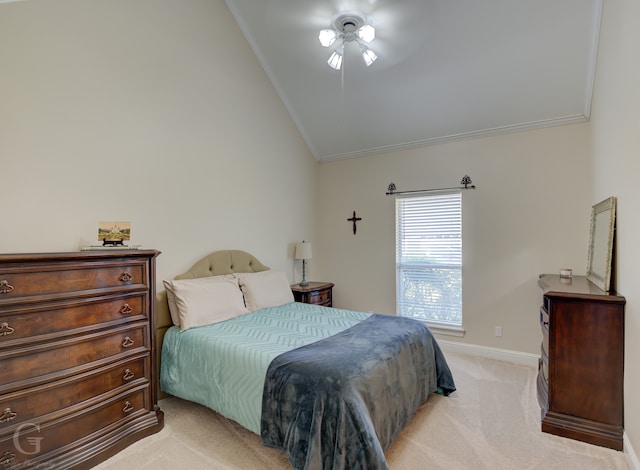 bedroom with ornamental molding, vaulted ceiling, ceiling fan, and light colored carpet