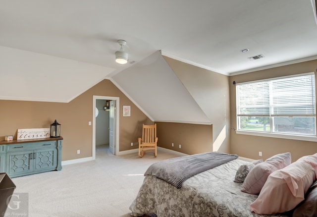 bedroom with crown molding, lofted ceiling, ceiling fan, and light carpet