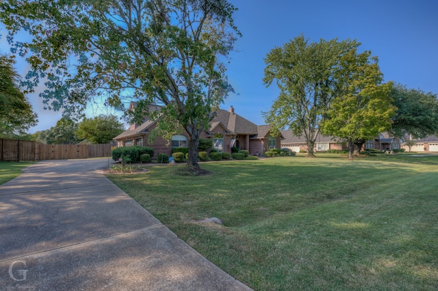 ranch-style home with a front lawn