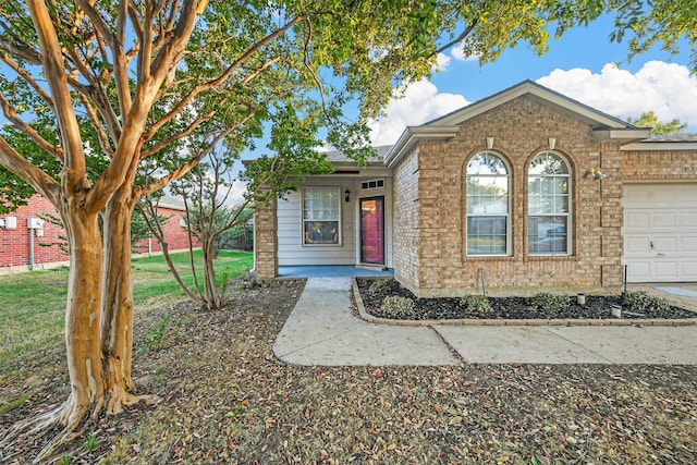 view of front of house with a front lawn and a garage