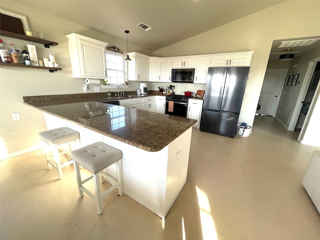 kitchen with white cabinets, stove, lofted ceiling, kitchen peninsula, and stainless steel refrigerator