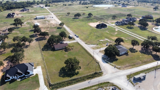 bird's eye view with a water view and a rural view