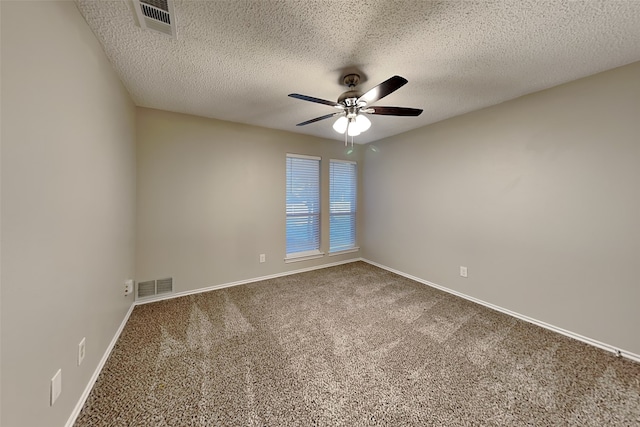 carpeted empty room featuring a textured ceiling and ceiling fan