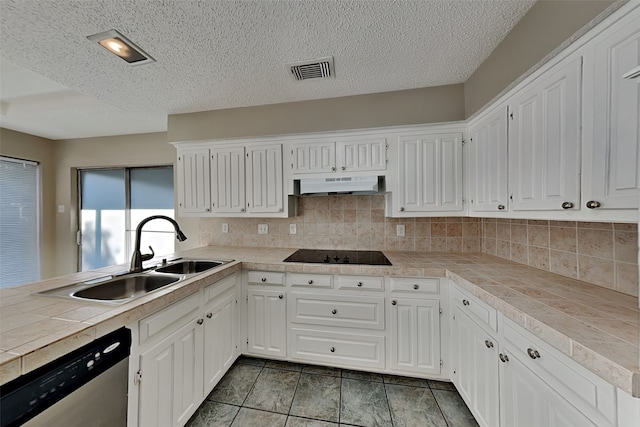 kitchen with dishwasher, sink, white cabinets, tile countertops, and black electric cooktop